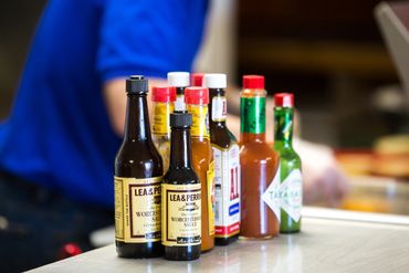 Row of hot sauce bottles