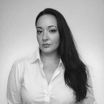 Black and white portrait of a woman with long hair.