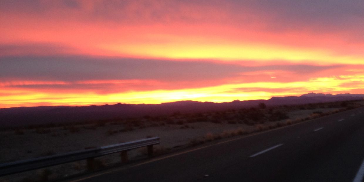 A highway in the desert with beautiful sunset 