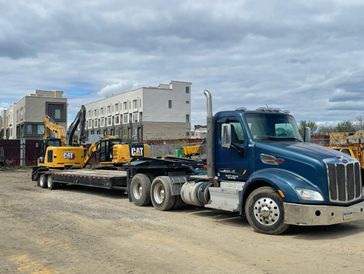 Tri Axle Truck with excavator