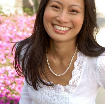 Picture of Dr. Jennifer Wong DDS Culver City CA dentist smiling and in city clothes