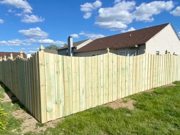 Scalloped Pine Fence with Decorative Post Caps in Danville, IN