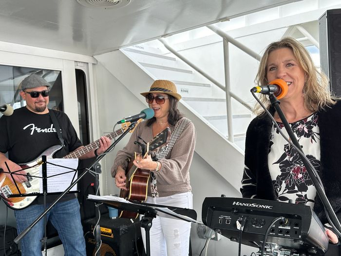 Guava Jelly plays music on a Watermark yacht luxury cruise, May 2024.