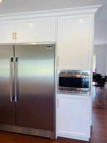 Kitchen with white cabinets and stainless steel appliances