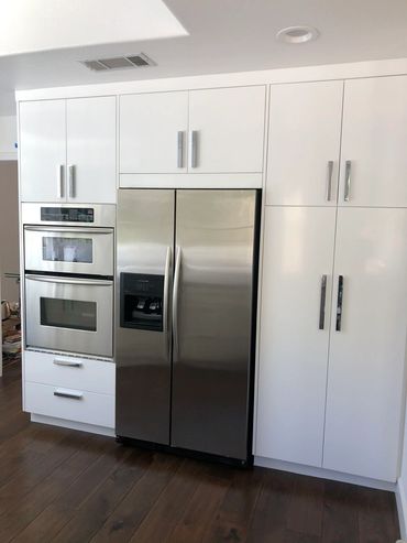Kitchen with white cabinets and stainless steel appliances