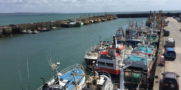 Newlyn harbour, featuring marine electronics including radar, VHF antenna, Ivms trackers MF/HF anten