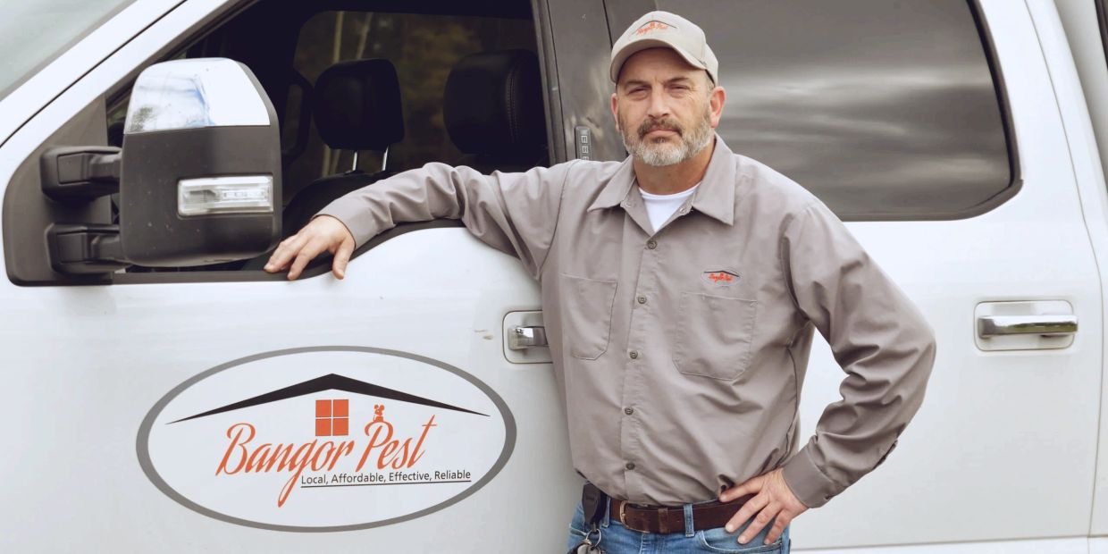 Keith Kelley standing next to service vehicle