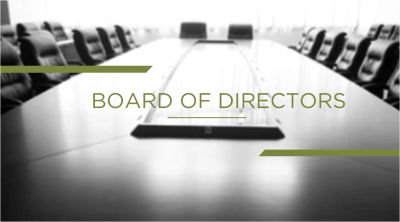 Empty boardroom table with chairs.