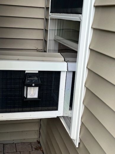 Window-mounted air conditioning unit with a light.
