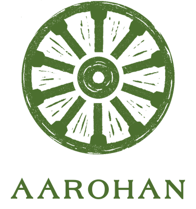 Green circular emblem with spokes and 'AAROHAN' text below.
