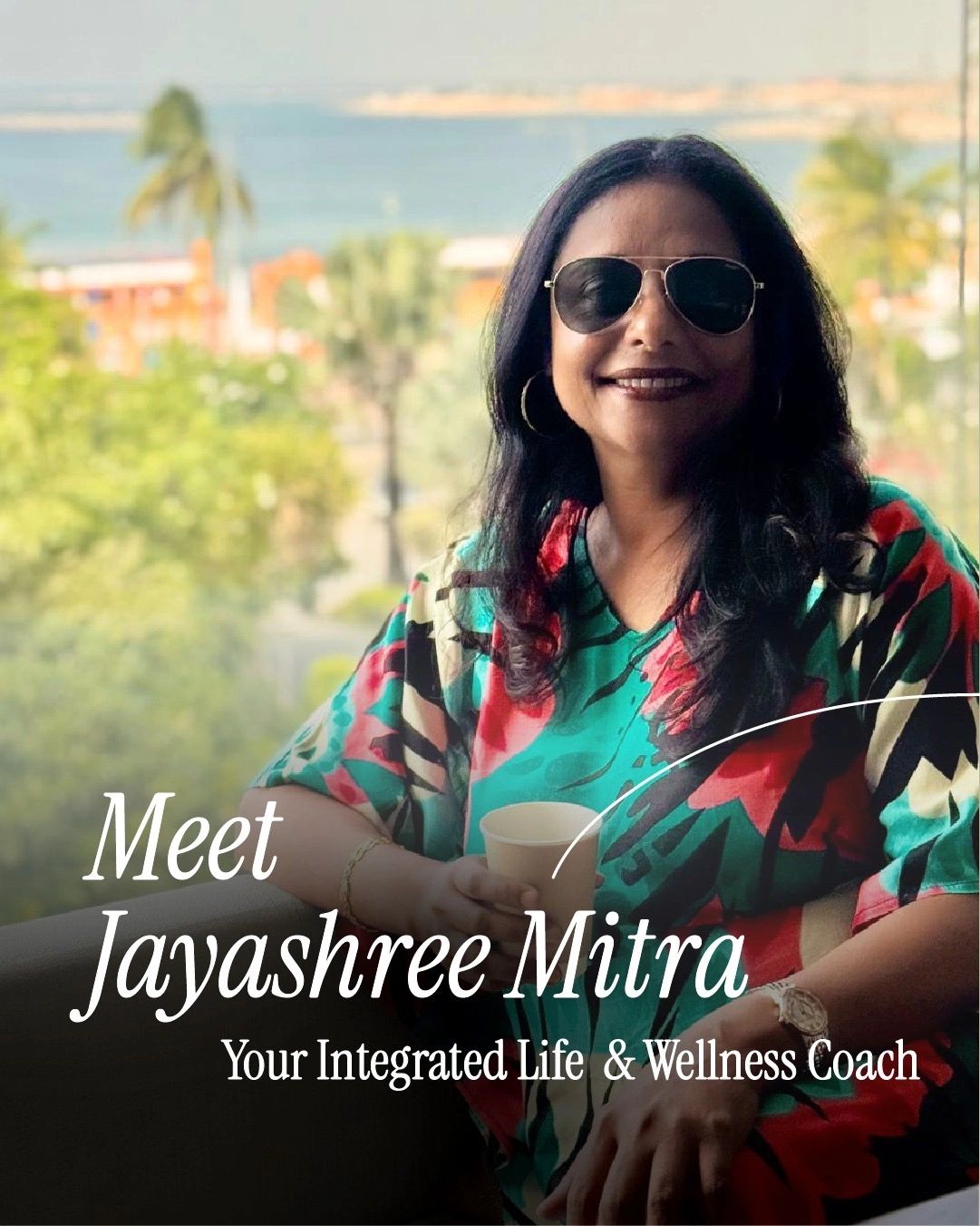Jayashree Mitra, your Integrated Life &amp; Wellness Coach, smiling with sunglasses and a colorful top.