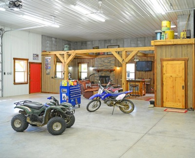 Pole Barn man cave with motorcycles, den and a bathroom.