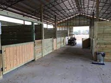 Pole Barn used to create horse stables.