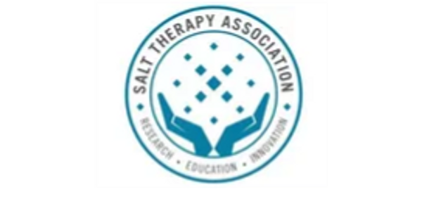 Logo of Salt Therapy Association with hands and salt particles.