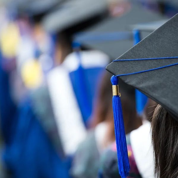 blurred image of graduating class with caps and tassels