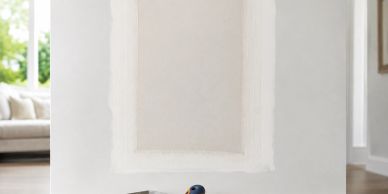 Paint samples on a wall with a paint roller.