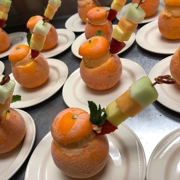 Orange with sorbet and fruit dessert