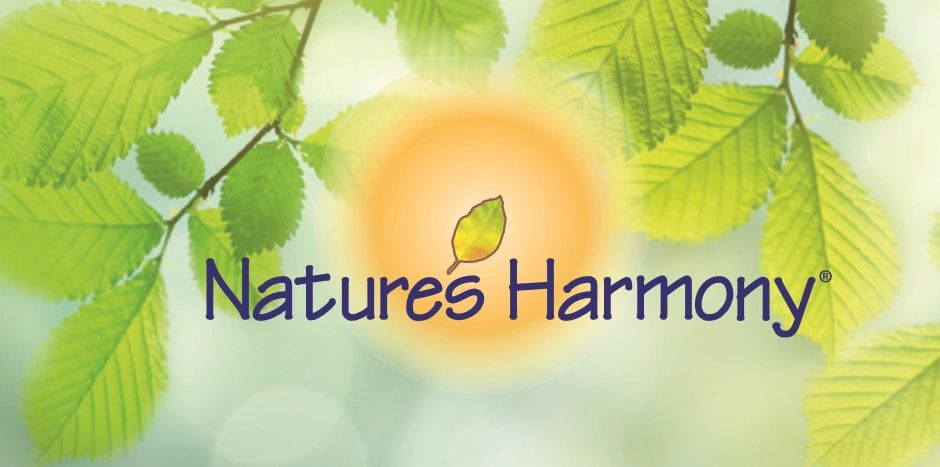 Logo of Natures Harmony with green leaves and sun background.