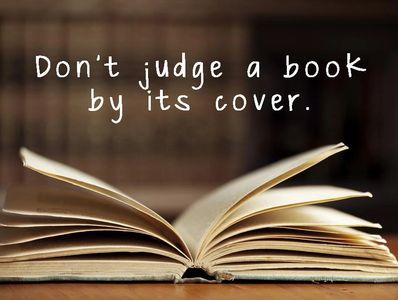 Open book with the quote, 'Don't judge a book by its cover.'