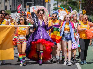 See why New York is delighted to host the largest Pride celebration in the world. Over 100,00 marchers hit the streets for the world's largest Pride Day march, marking Stonewall's 50th anniversary with floats, dignitaries, activists & others, cheered on by millions of spectators.