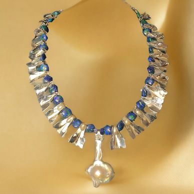 A neckpiece of sterling silver beautiful natural fresh water pearls; separated by azurite/malachite 