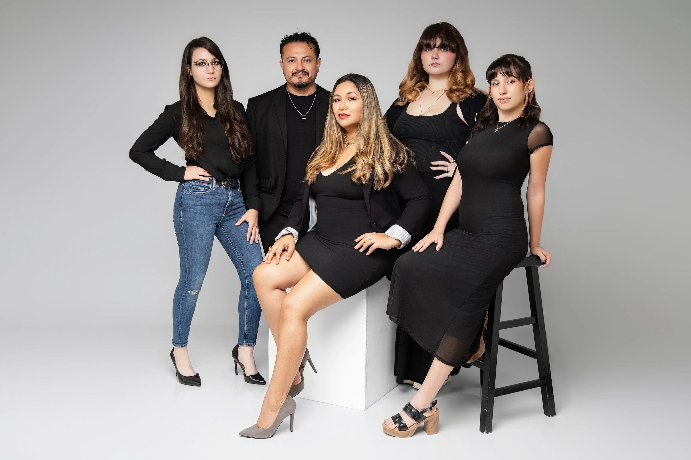 Houston Imagery Studio LLC portrait photography team posed together in their Houston studio.