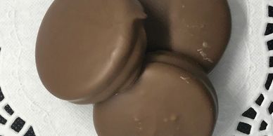 Sandwich cookies dipped in milk chocolate