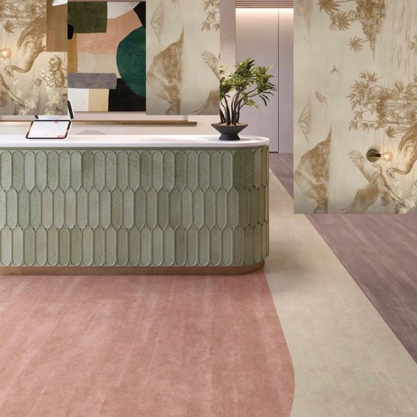 Mostrador verde con diseño geométrico y planta decorativa.