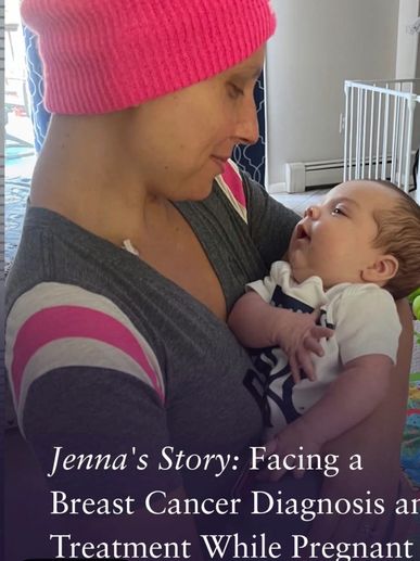 A woman wearing a pink beanie lovingly holds a baby, sharing a tender moment.