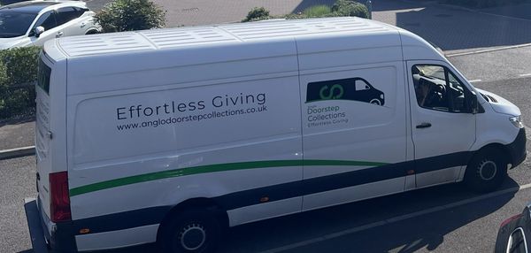 A white delivery van with 'Effortless Giving' and company branding on the side.