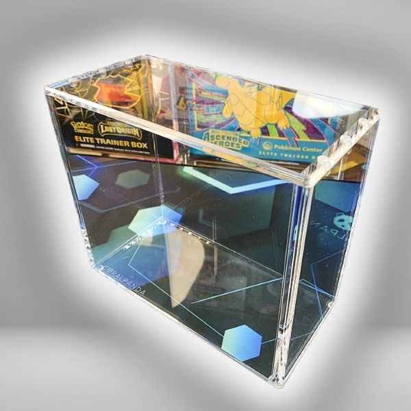 Clear acrylic card holder with Pokémon Elite Trainer box packaging reflections.