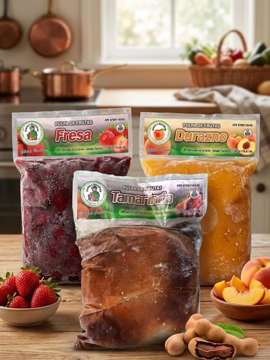 Three frozen fruit pulp packs: strawberry, peach, and tamarind on a kitchen counter.