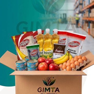 Box filled with groceries including oil, sugar, eggs, fruits, and lentils.