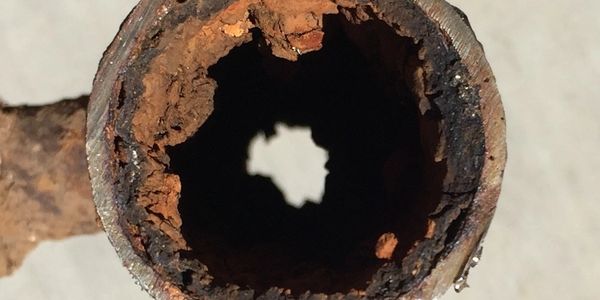 Corroded Pipe, rusting pipe, damaged waterline