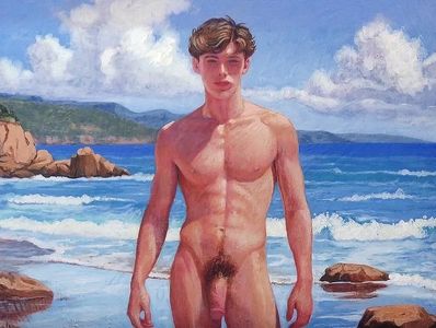 A nude young man standing on a rocky beach under a bright sky.