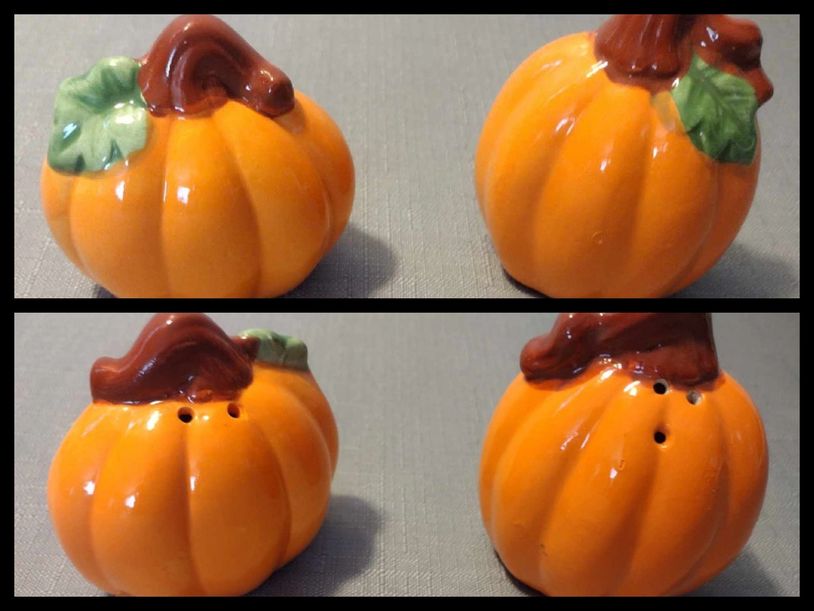 Ceramic pumpkin-shaped salt and pepper shakers with green leaves and brown stems.