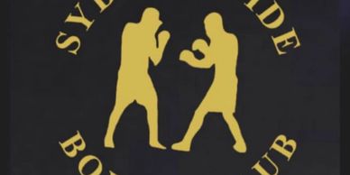 Logo of Sydney Pride Boxing Club with two boxers in gold.