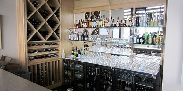 Lovely designed restaurant  mirrored bar area with wine rack, optics and undercounter refrigeration