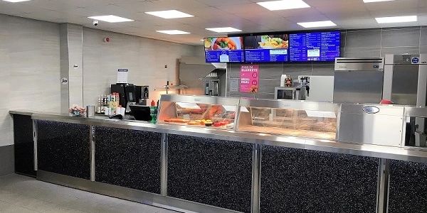 Inside Finnegans Fish & Chips Shop showing the hot food counter and menus on the wall