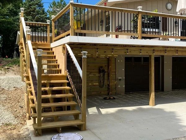 Elevated wood deck on a two-story home.