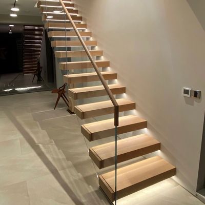 Cantilevered floating staircase with box treads and glass balustrades 