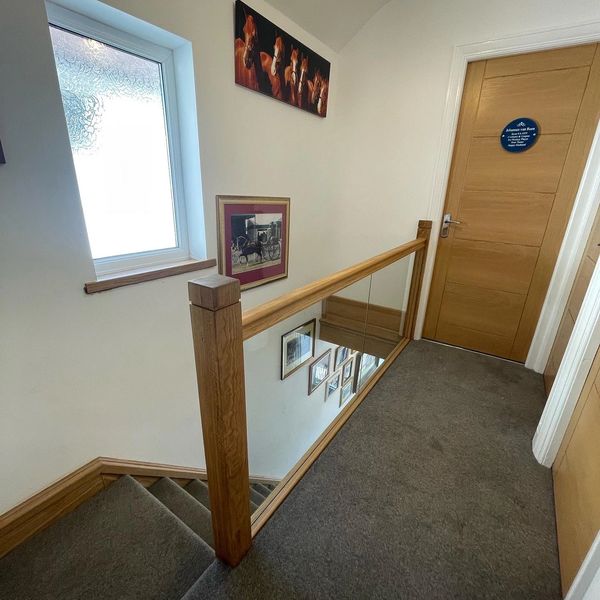 Oak and glass staircase renovation in Hemel Hempstead, Hertfordshire. kerfed shadow gap posts.