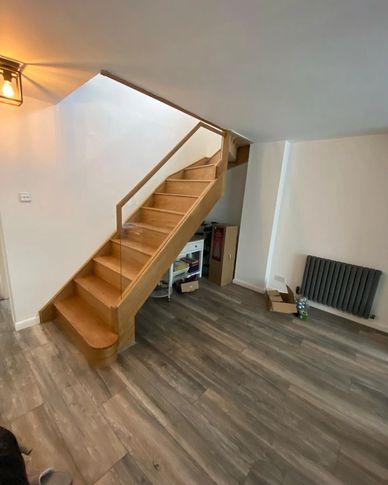 Oak with frameless glass staircase renovation in Potters Bar, Hertfordshire 