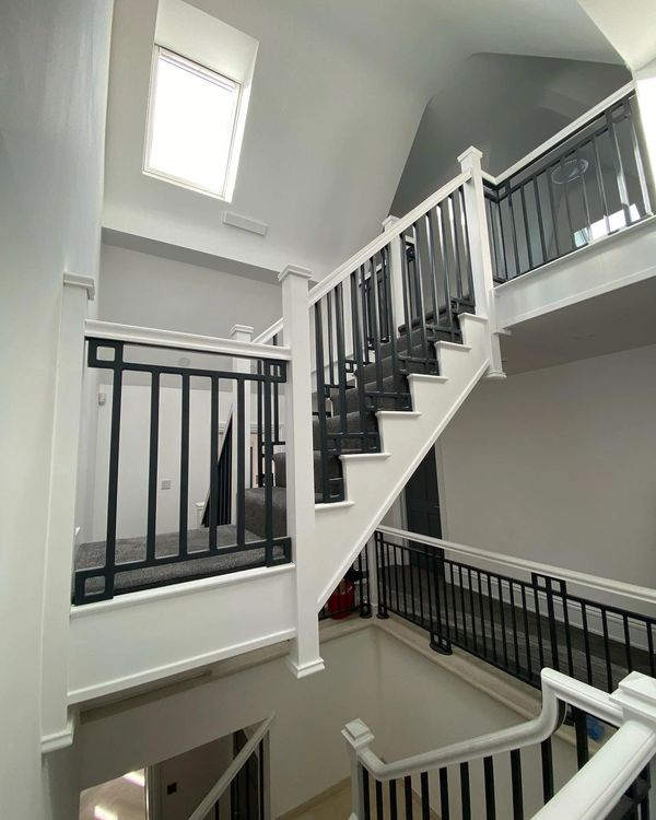Bespoke quarter landing staircase with one of a kind metal balustrades in Markyate, Hertfordshire