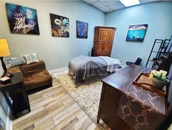 Massage therapy room with table and relaxing environment