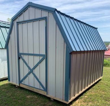8x10 all metal Barn gray with ocean trim and roof. Single barn door.