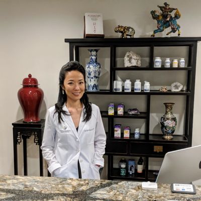 Dr. Lin at Front desk, Center for Acupuncture