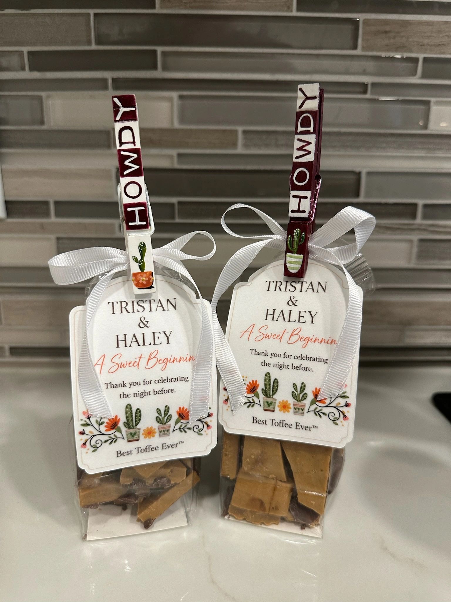Two packets of toffee with personalized tags for Tristan and Haley.