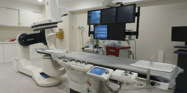 A modern medical imaging room with advanced diagnostic equipment.