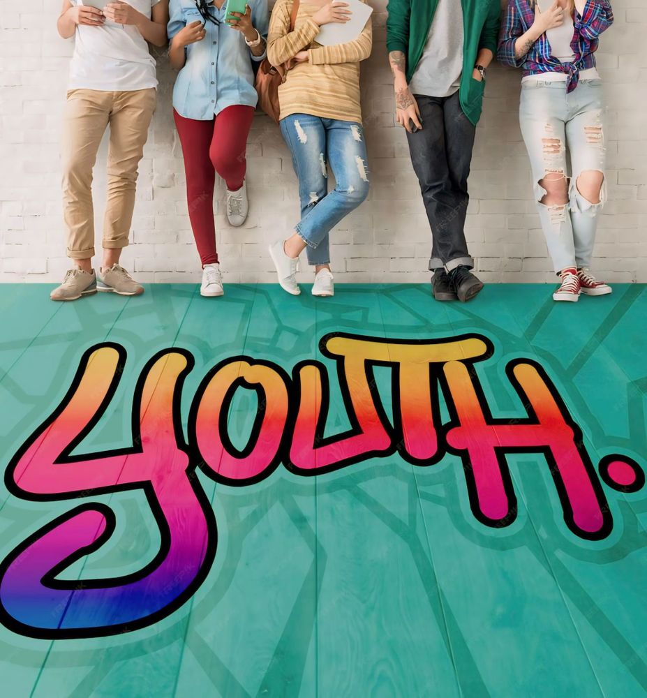 Youth standing against a wall with colorful 'YOUTH' graffiti on the floor.